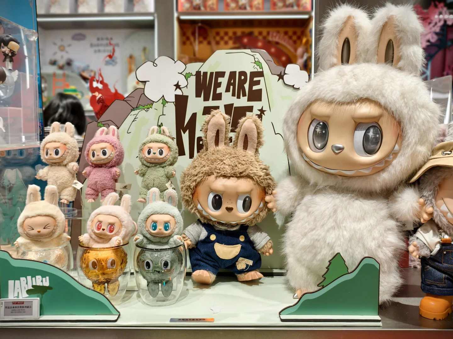 A display of various Labubu character toys, including plush figures and collectible designs, illustrating the popular products driving PopMart's global demand.