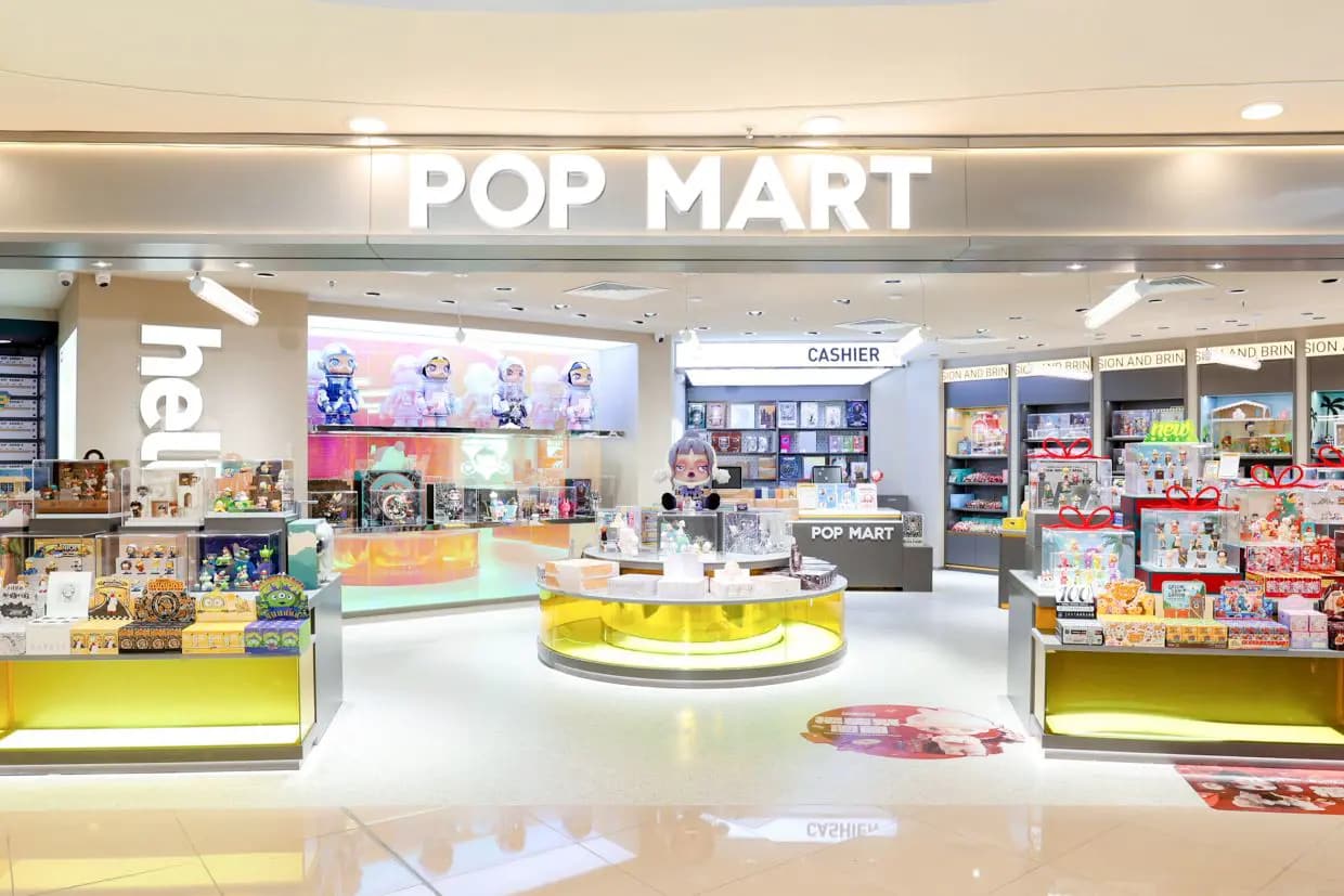 A bright and colorful Pop Mart retail store showcasing its wide array of collectible designer toys.